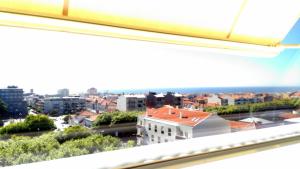 a view of a city from a window at Panorama Penthouse in Espinho