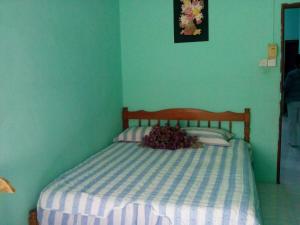 Ένα ή περισσότερα κρεβάτια σε δωμάτιο στο Shima Homestay +5 φωτογραφίες