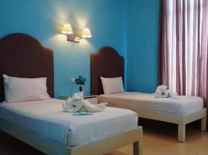 Uma cama ou camas num quarto em Hotel Lorenza
