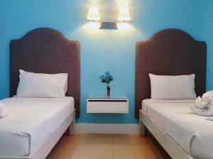 Uma cama ou camas num quarto em Hotel Lorenza