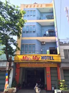 a building with a hotel sign in front of it at My My Hotel in Quảng Ngãi