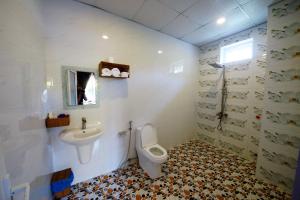 Koupelna v ubytování Q Songchi Hotel