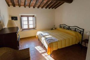 Postel nebo postele na pokoji v ubytování Frantoio di Corsanico + 37 fotografií