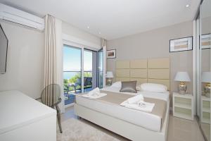 Posteľ alebo postele v izbe v ubytovaní Villa Olive Hill