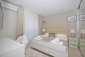 Posteľ alebo postele v izbe v ubytovaní Villa Olive Hill