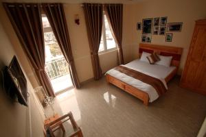 מיטה או מיטות בחדר ב-Gia Pham Hotel