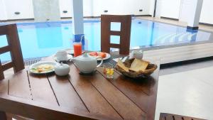 
a table that has some food on it at Leighton Resort in Negombo
