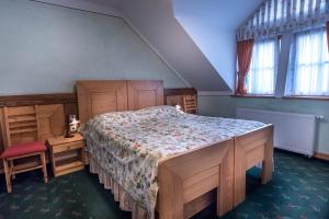Ένα ή περισσότερα κρεβάτια σε δωμάτιο στο Garni Hotel Pod Roglo Boharina 2