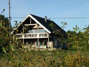 a house with a wrap around porch at Granbergs Gästhus in Eckerö +76 photos