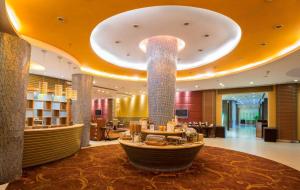 a hotel lobby with a large lobbyasteryasteryasteryasteryasteryasteryasteryasteryastery at NIRVANA Luxury Hotel l Ludhiana in Ludhiana