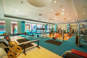 a gym with a lot of exercise equipment in it at NIRVANA Luxury Hotel l Ludhiana in Ludhiana