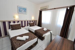 Postel nebo postele na pokoji v ubytování Reis Maris Hotel