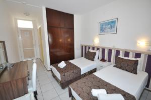 Postel nebo postele na pokoji v ubytování Reis Maris Hotel