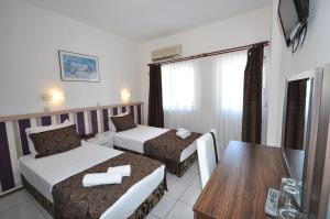 Postel nebo postele na pokoji v ubytování Reis Maris Hotel
