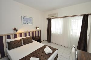 Postel nebo postele na pokoji v ubytování Reis Maris Hotel