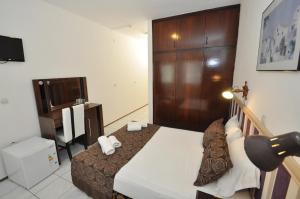 TV a/nebo společenská místnost v ubytování Reis Maris Hotel