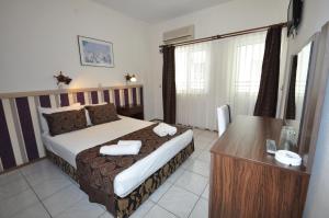 Postel nebo postele na pokoji v ubytování Reis Maris Hotel