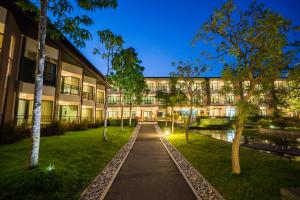 a building with a pathway in front of a building at i Tara Resort & Spa in Haad Chao Samran