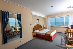 Postel nebo postele na pokoji v ubytování City Hotel