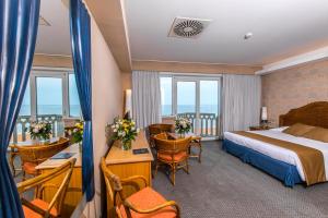 Postel nebo postele na pokoji v ubytování City Hotel