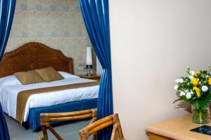 Postel nebo postele na pokoji v ubytování City Hotel