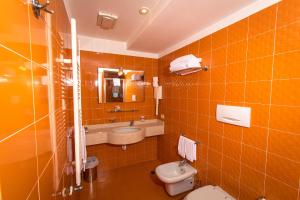 Koupelna v ubytování City Hotel
