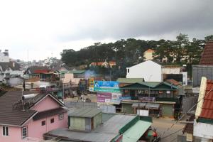a town with a lot of houses and buildings at Gia Pham Hotel in Da Lat