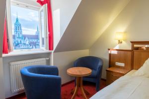 Postel nebo postele na pokoji v ubytování Hotel Bayernland + 29 fotografií