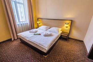 Rúm í herbergi á Hotel Lomsia