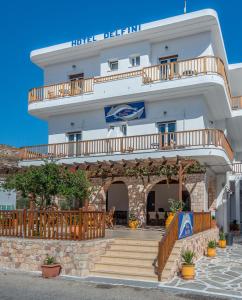 a hotel with a staircase in front of a building at Hotel Delfini in Adamantas