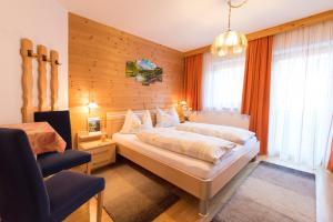 Łóżko lub łóżka w pokoju w obiekcie Appartement Alpina