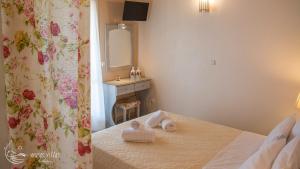 Postel nebo postele na pokoji v ubytování Muses Villas