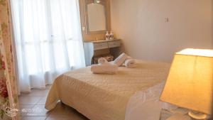 Postel nebo postele na pokoji v ubytování Muses Villas