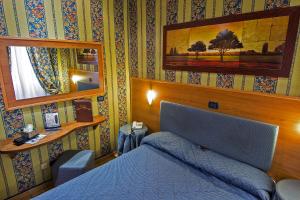 Postel nebo postele na pokoji v ubytování Hotel Lirico