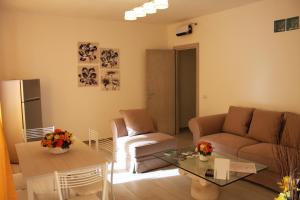 a living room with a couch and a table at B&B Castello Salvaterra in Iglesias