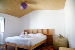 Ένα ή περισσότερα κρεβάτια σε δωμάτιο στο City's Hostel Ponta Delgada