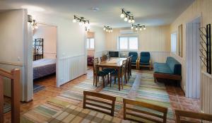 a room with a living room and a dining room at Niemilomat in Varkaus +114 photos