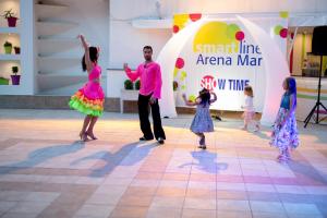 a group of children are dancing on a dance floor at Arena Mar Hotel and SPA in Golden Sands