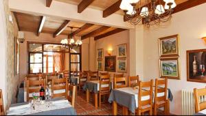 a restaurant with a dining room with tables and chairs at Agroturismo Son Marge in Campos