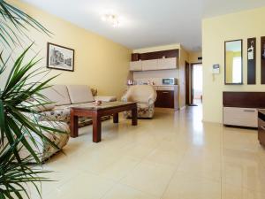 a living room with a couch and a table at Bright House in Plovdiv