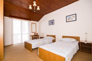 Posteľ alebo postele v izbe v ubytovaní Apartment Srđ