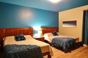 Łóżko lub łóżka w pokoju w obiekcie Chalet 19 Chemin Blanc by Les Chalets Alpins