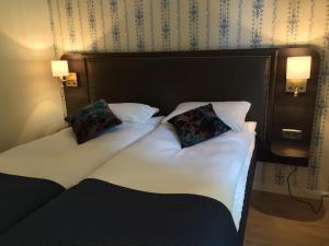 Postel nebo postele na pokoji v ubytování Hotell Eikerapen Gjestegård Åseral