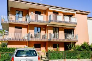 a building with a car parked in front of it at 1Dest - White Dream in Riva del Garda