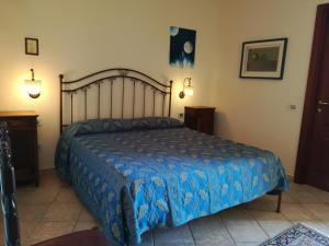 Postel nebo postele na pokoji v ubytování Villa Loreto + 37 fotografií