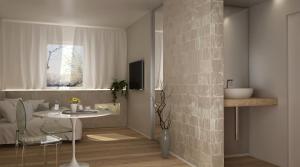 Televízia a/alebo spoločenská miestnosť v ubytovaní Hotel Le Ginestre Family & Wellness