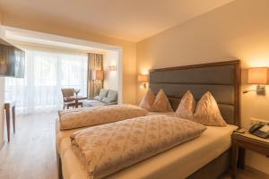 Postel nebo postele na pokoji v ubytování Hotel Niederreiter