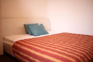 מיטה או מיטות בחדר ב-Kukucinova Apartments