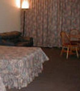 Ένα ή περισσότερα κρεβάτια σε δωμάτιο στο Hotel Royalty