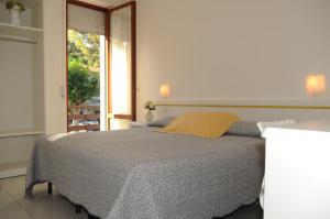Llit o llits en una habitació de Albergo Ester